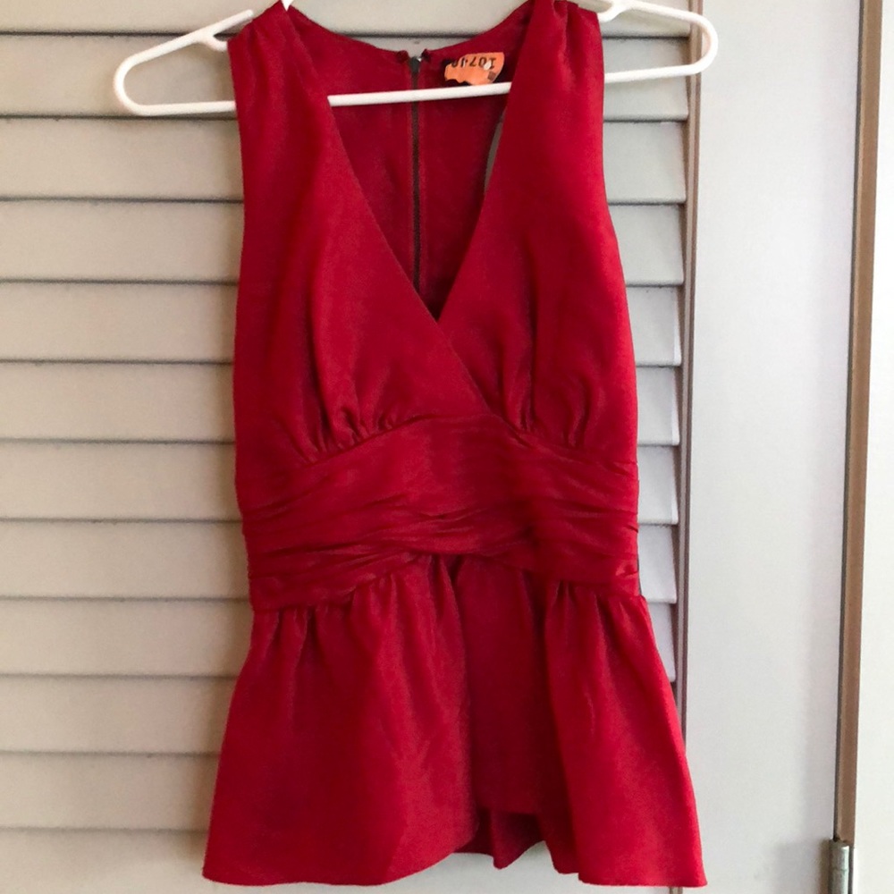 Bebe red silk peplum v-next shirt